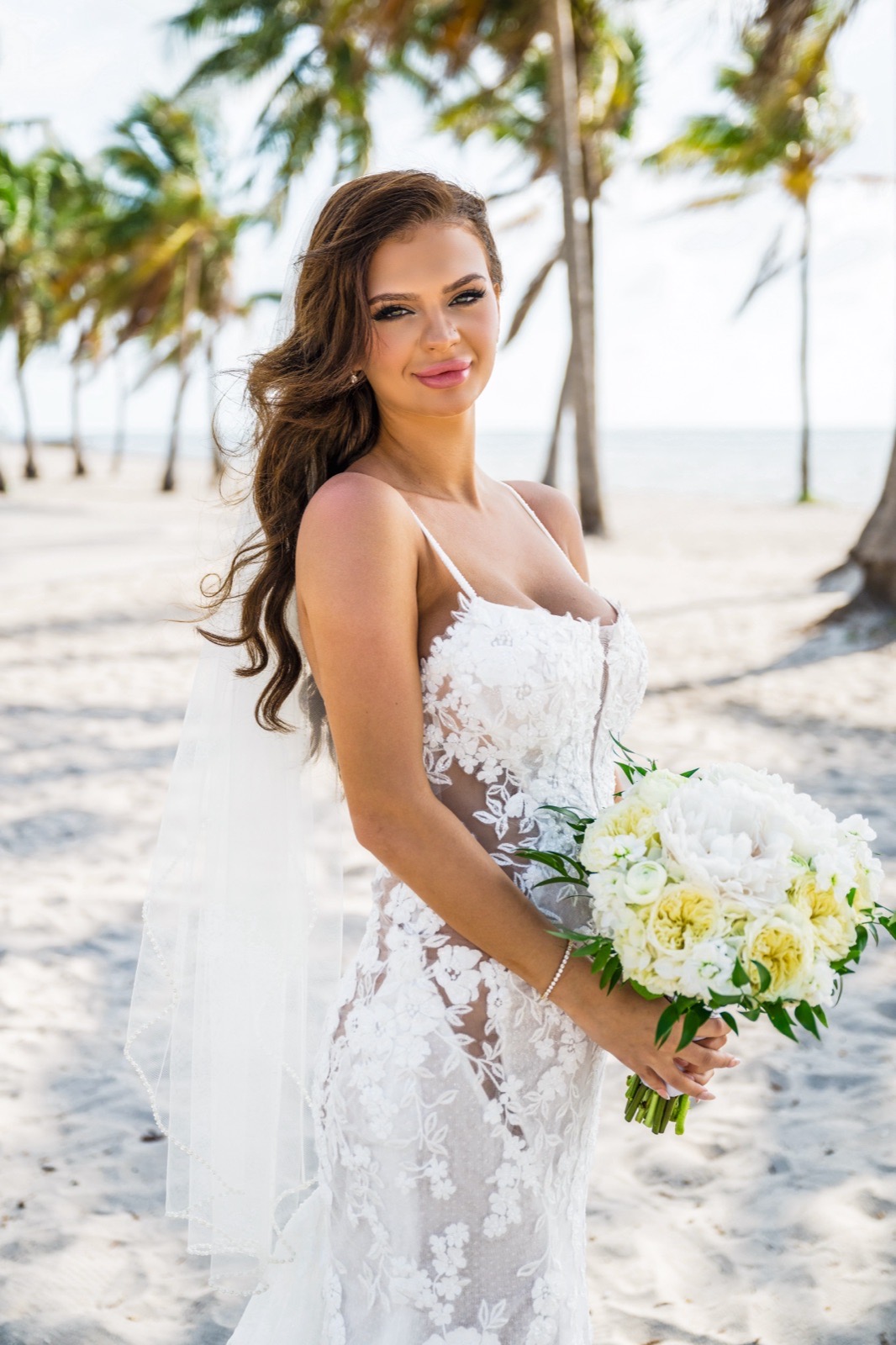 Full-length wedding portrait of a bride with a natural bridal spray tan by Sunkiss Studios