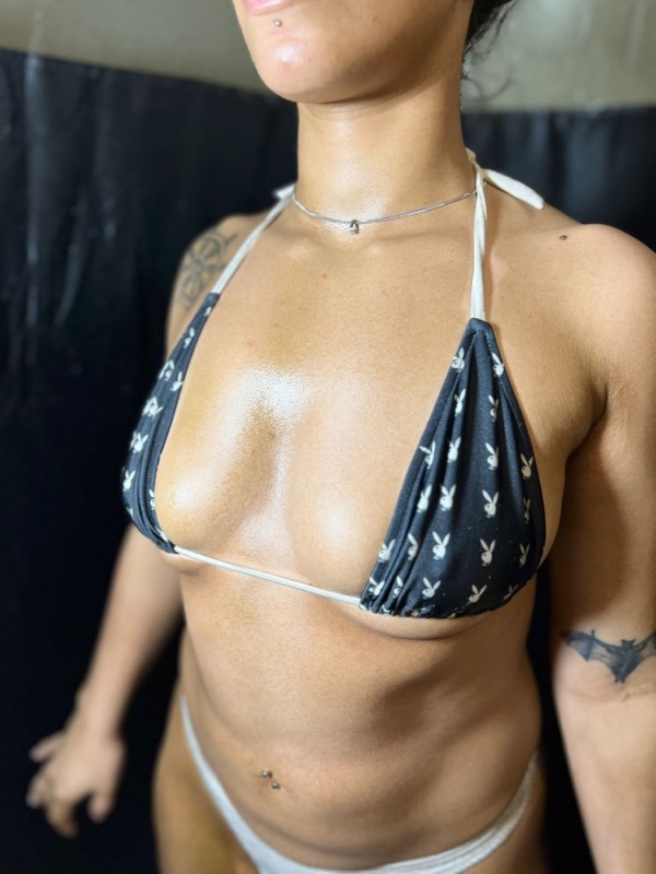 Client result photo showing an even custom spray tan in the Sunkiss Studios tanning tent