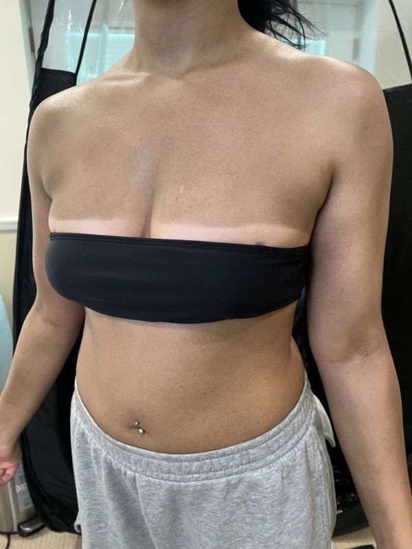 Torso result photo showing crisp tan lines from a custom airbrush tan